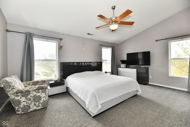 bedroom featuring carpet floors, multiple windows, baseboards, and vaulted ceiling