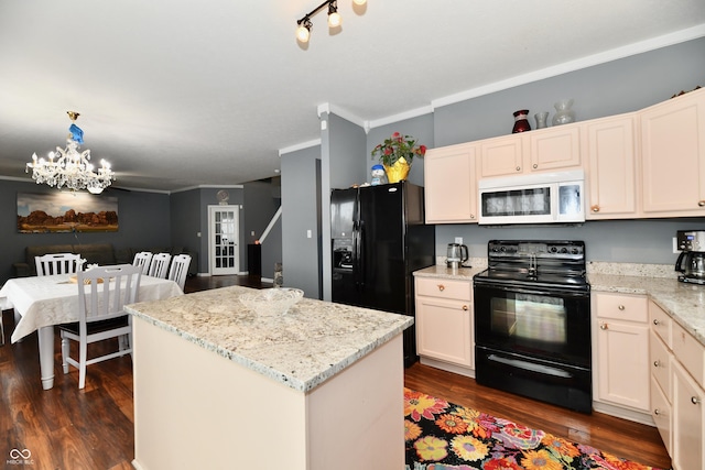 kitchen with dark wood-type flooring, a center island, black appliances, and light stone countertops