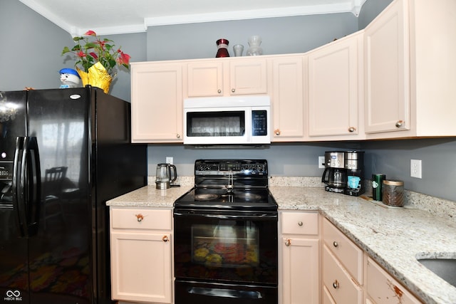 kitchen featuring light stone counters, white cabinetry, crown molding, and black appliances