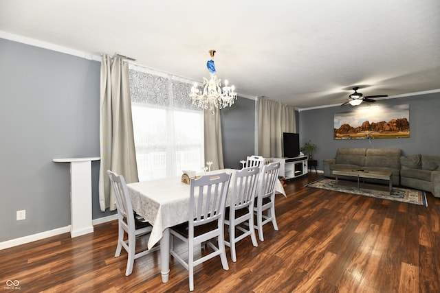 dining space featuring ornamental molding, ceiling fan with notable chandelier, baseboards, and wood finished floors