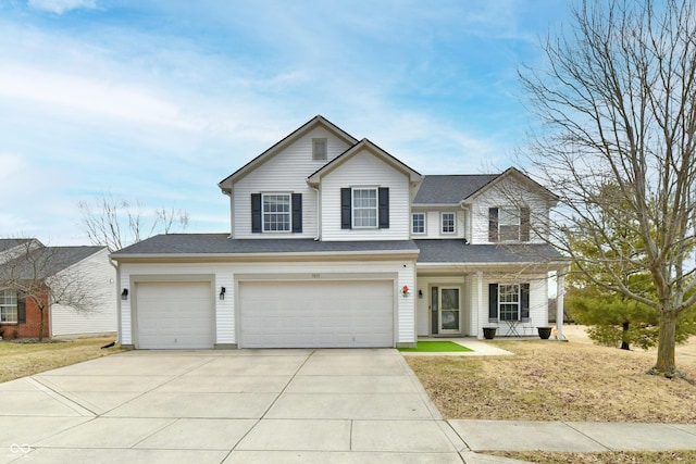 traditional home featuring concrete driveway and a shingled roof