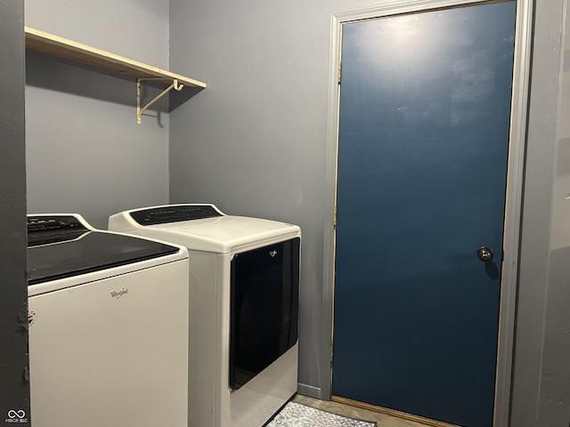 clothes washing area featuring washing machine and dryer and laundry area