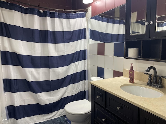 full bath with toilet, curtained shower, tile walls, decorative backsplash, and vanity