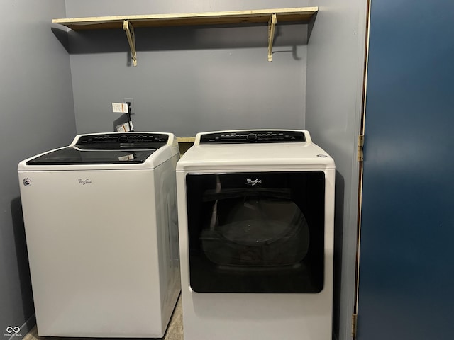 laundry area featuring separate washer and dryer and laundry area