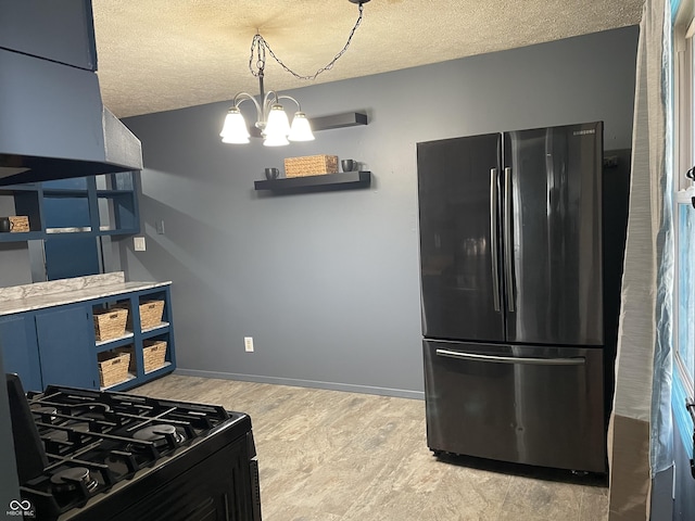 kitchen featuring baseboards, an inviting chandelier, open shelves, freestanding refrigerator, and black gas range