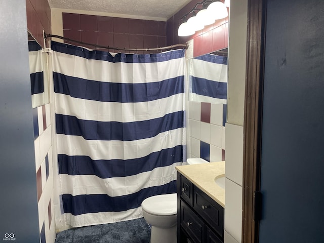 bathroom with a shower with shower curtain, toilet, a textured ceiling, and vanity