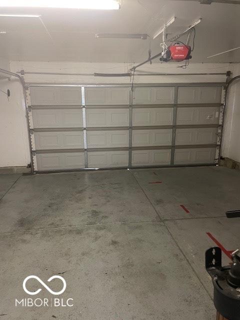 8249 Retreat Ln, Indianapolis, IN 46259 - garage featuring a garage door opener
