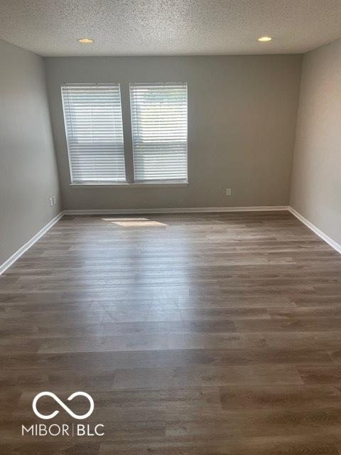 8249 Retreat Ln, Indianapolis, IN 46259 - empty room with baseboards and wood finished floors