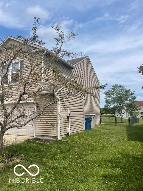 8249 Retreat Ln, Indianapolis, IN 46259 - view of side of home featuring a lawn