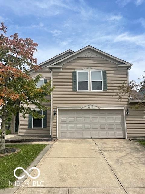 8249 Retreat Ln, Indianapolis, IN 46259 - traditional-style home featuring concrete driveway and a garage