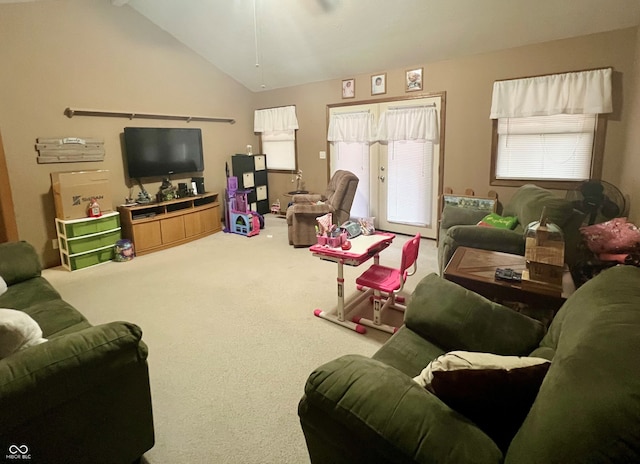 living area with vaulted ceiling and carpet flooring