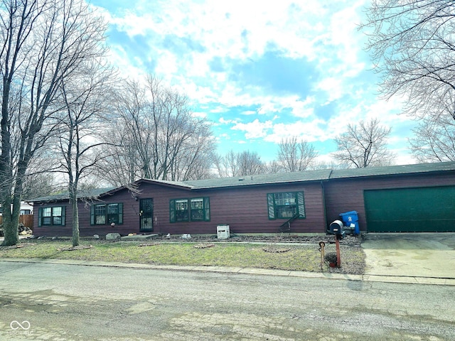 view of front of home with driveway and an attached garage