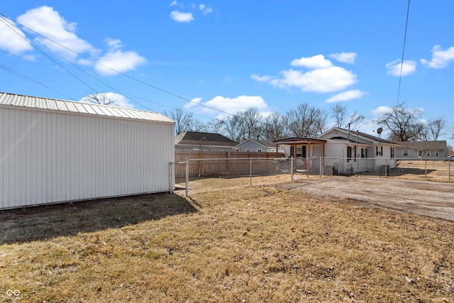 view of yard featuring a fenced backyard and an outdoor structure