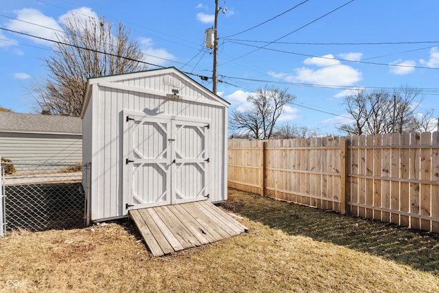 view of shed featuring a fenced backyard