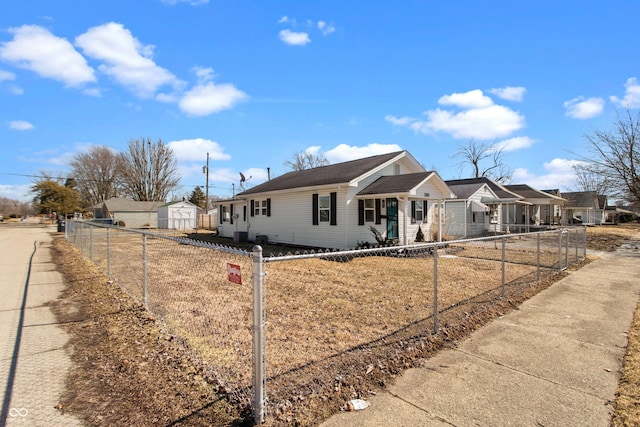 view of front facade featuring a fenced front yard and a residential view