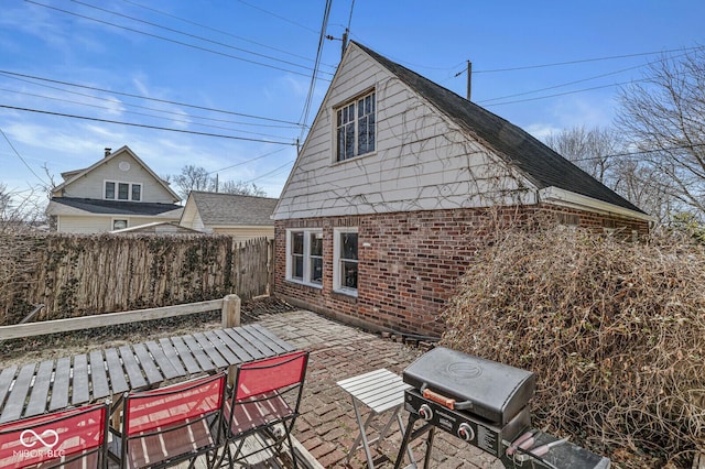 view of patio featuring fence