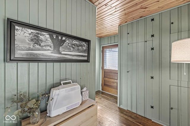 misc room featuring wooden ceiling, wood walls, and wood finished floors