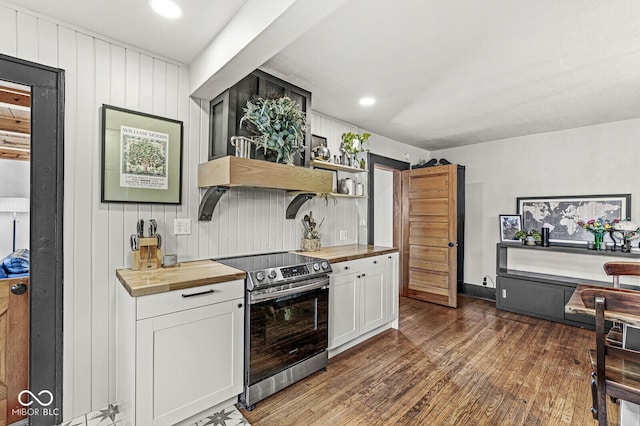 kitchen featuring electric range, white cabinets, wooden counters, dark wood-style floors, and open shelves