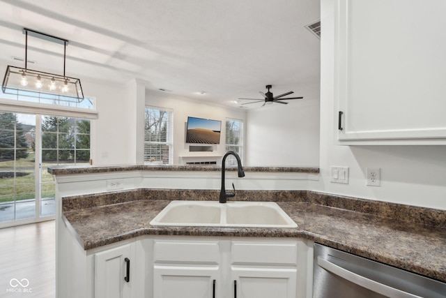 5682 Castor Way, Noblesville, IN 46062 - kitchen with a sink, dishwasher, a ceiling fan, white cabinetry, and decorative light fixtures