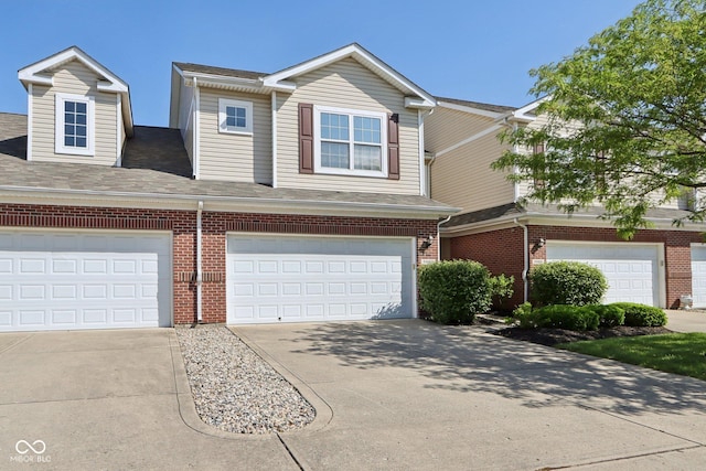 5682 Castor Way, Noblesville, IN 46062 - view of front of house featuring concrete driveway, brick siding, roof with shingles, and an attached garage