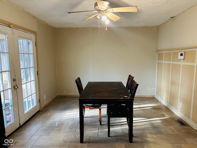 dining area featuring a wealth of natural light, visible vents, french doors, and a ceiling fan