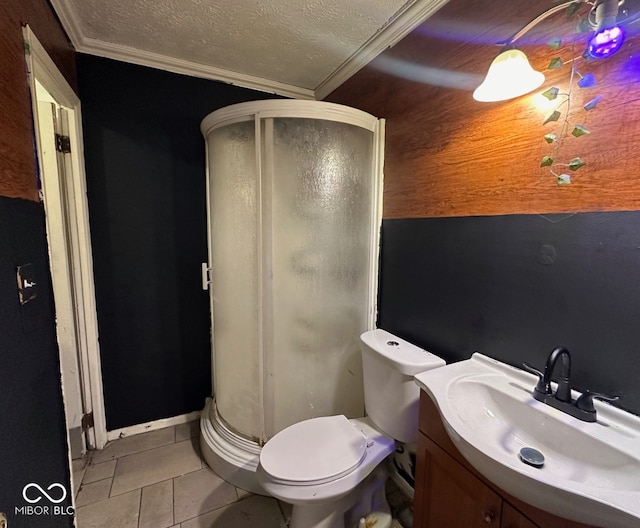 full bath featuring vanity, a shower stall, tile patterned floors, and a textured ceiling