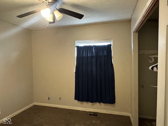 unfurnished bedroom with visible vents, ceiling fan, baseboards, a closet, and a textured ceiling