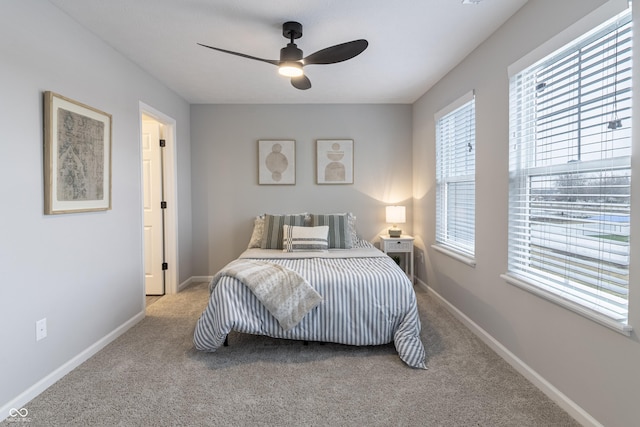 bedroom with carpet, ceiling fan, and baseboards