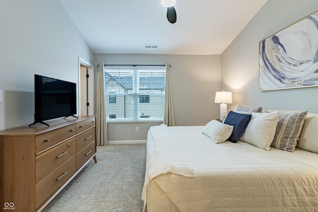 bedroom with light carpet, baseboards, and visible vents