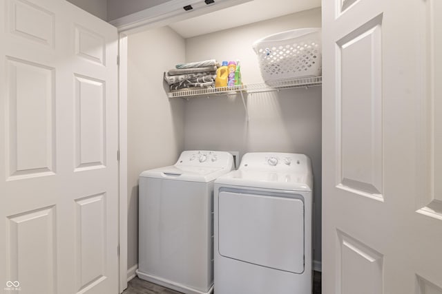 clothes washing area featuring laundry area and washing machine and clothes dryer