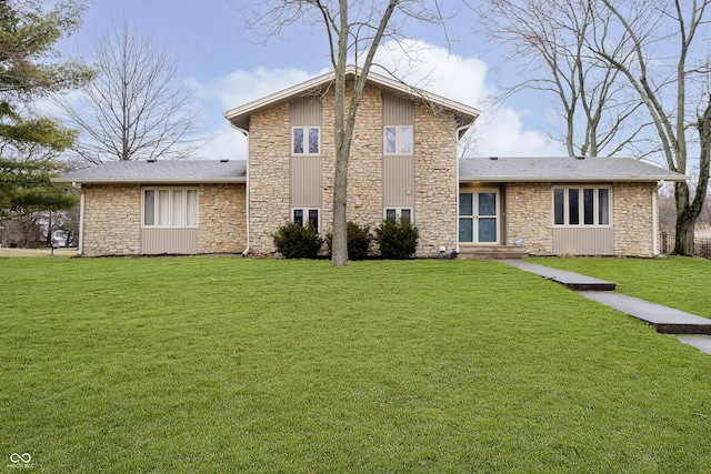 back of house with a lawn