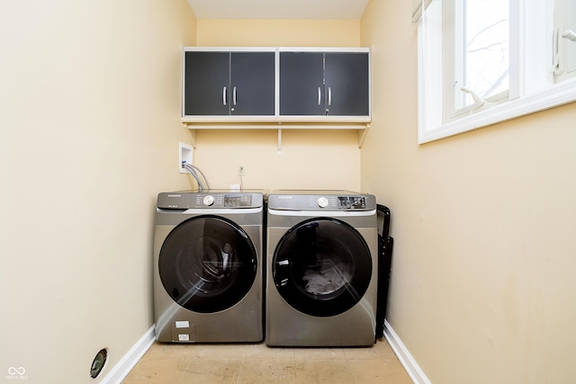 laundry area with washer and dryer, laundry area, and baseboards