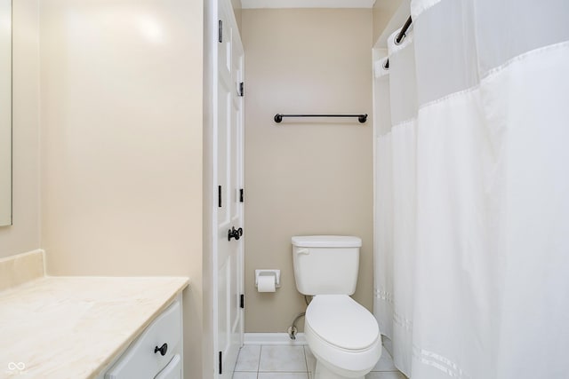 full bath with a shower with curtain, toilet, vanity, tile patterned flooring, and baseboards