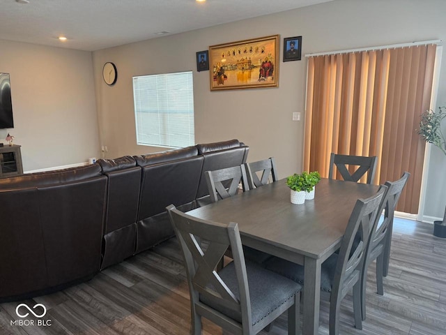 dining area featuring recessed lighting and wood finished floors