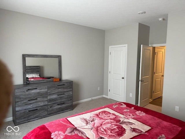 carpeted bedroom with baseboards