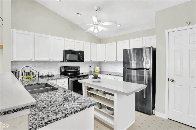 kitchen with stainless steel appliances, a sink, white cabinets, vaulted ceiling, and open shelves