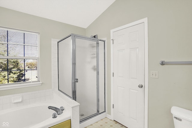 bathroom with a stall shower, toilet, tile patterned floors, vaulted ceiling, and a bath