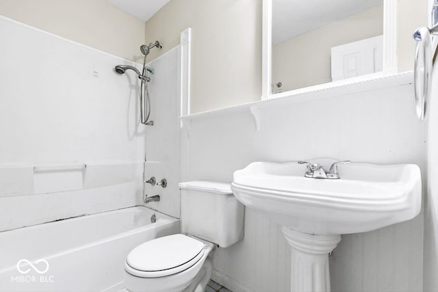 full bathroom featuring toilet and  shower combination