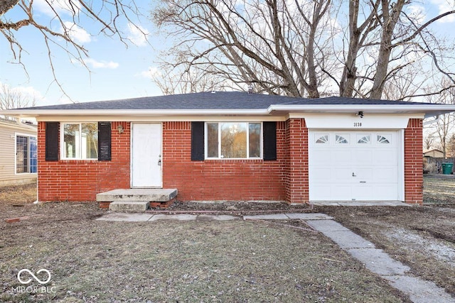 single story home with brick siding and an attached garage