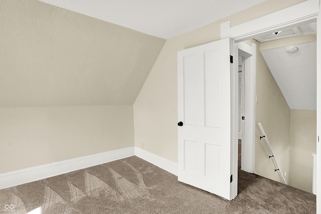 bonus room featuring carpet, baseboards, and vaulted ceiling