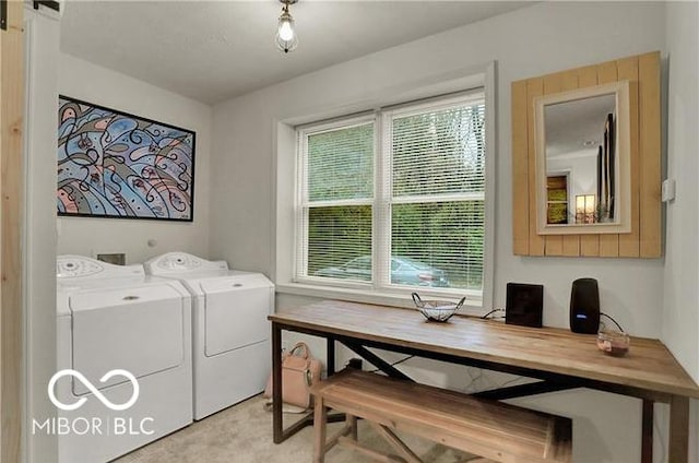 laundry area featuring laundry area, washing machine and clothes dryer, and a barn door