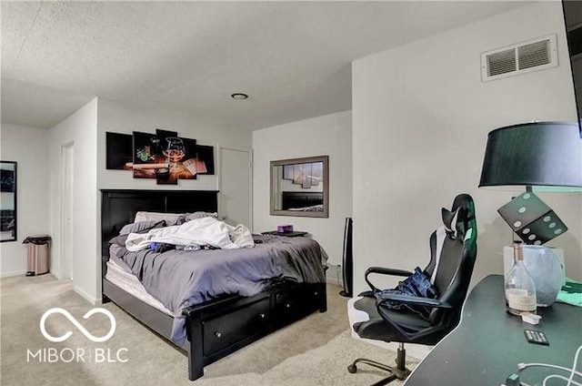 carpeted bedroom with a textured ceiling, visible vents, and baseboards