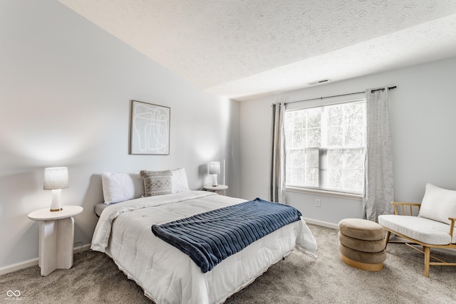 carpeted bedroom featuring visible vents, a textured ceiling, baseboards, and vaulted ceiling