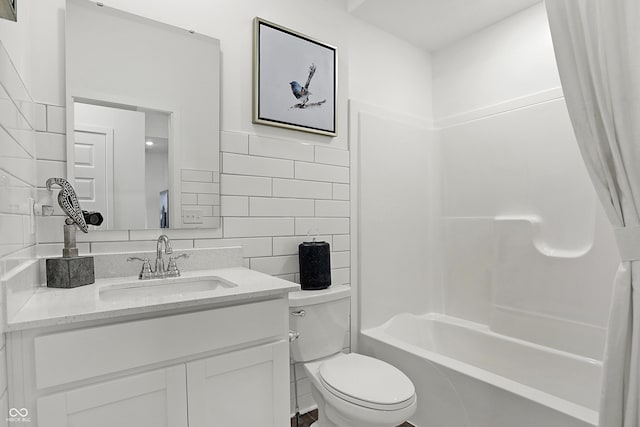 full bath with toilet, shower / bathtub combination, vanity, and tile walls