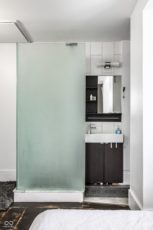 bathroom with vanity and baseboards
