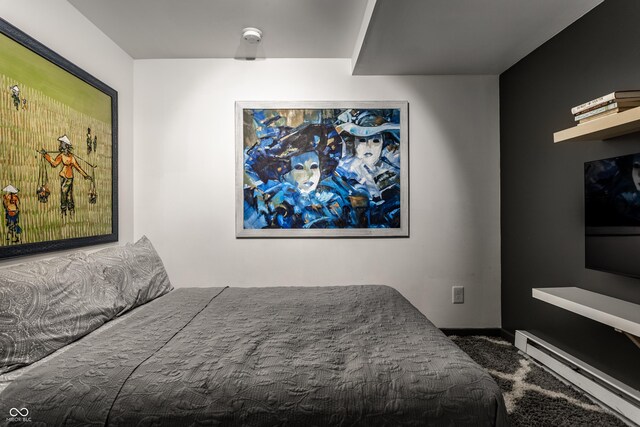bedroom with a baseboard heating unit