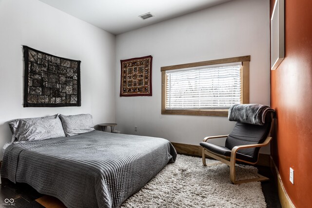 bedroom featuring visible vents
