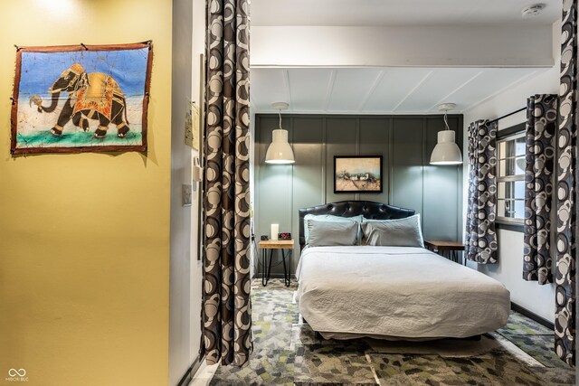 bedroom with beam ceiling