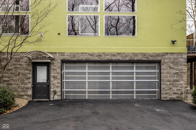 garage with aphalt driveway