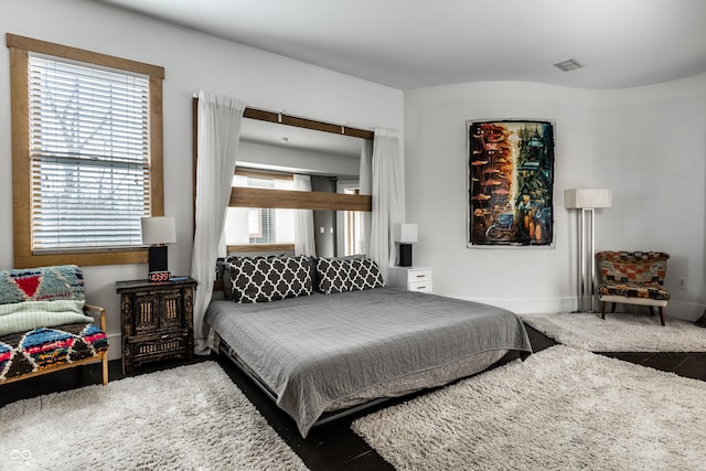 bedroom featuring visible vents